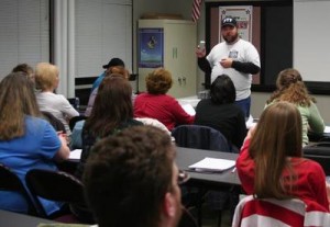 Greg Myers, Paranormal Task Force president, displays an electromagnetic fluctuation detector to attendees of the Saline County Career Center-sponsored ghost hunting class Saturday, March 21. Paranormal activity, Myers said, often results in release of electromagnetic energy. (Geoff Rands/Democrat-News)